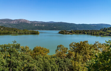 Fototapeta na wymiar Located in Isparta Eğirdir, Turkey, Lake Kovada National Park is getting ready for autumn...