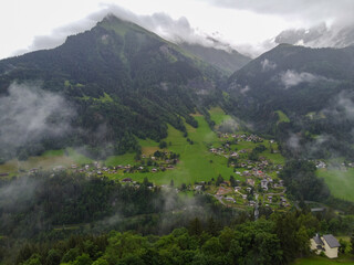 Panoramic view on mountain villages, green forests and apline meadows near Saint-Gervais-les-Bains,...