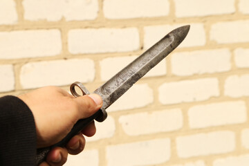 Vintage bayonet knife in the hand