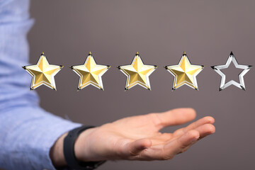 Customer hand touching to yellow illustration 5 stars virtual screening monitor for satisfaction evaluation