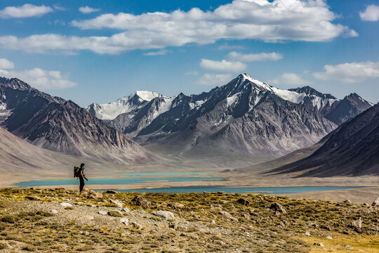 Photographer in wild mountain tajikistan pakistan with lake