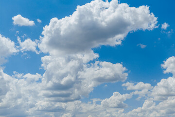 Beautiful blue sky with whipped white clouds that are illuminated by the sun