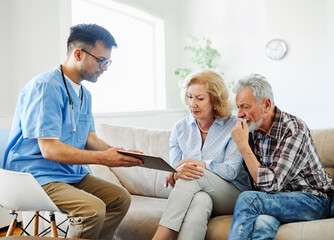 nurse doctor senior couple care caregiver help assistence retirement home nursing elderly man woman...