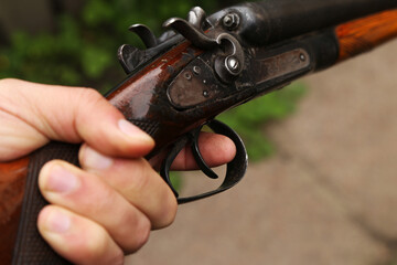 Vintage shotgun in the hand