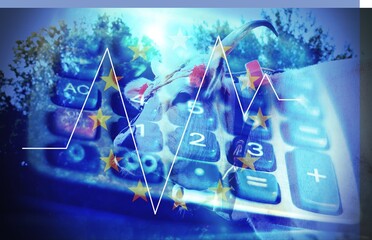 Close up of a modern calculator with a blue light and a cow , concept of business with meat .