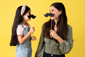 Family having fun with face mustaches