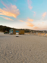 beach huts at sunset