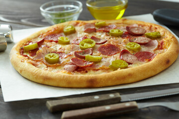 tasty pizza on the wooden background