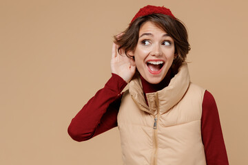 Young curious nosy caucasian woman 20s wears red turtleneck vest beret try to hear you overhear...