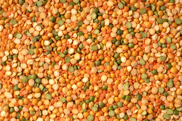 Different legume texture background: raw lentil, mung, white, green and red bean. Natural protein source. Vegan and vegetarian food. Uncooked colorful beans mixture. Top view