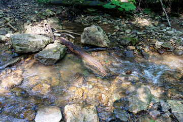 Obraz premium Mountain range, sources, hiking trail along the bank of a mountain river, natural stone, background, panoramic views of the mountainous terrain.
