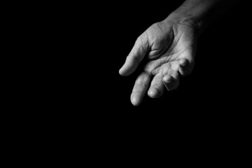 Male hand held out, gesturing or offering help