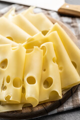 Sliced hard cheese.