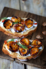Delicious toast with cream cheese and grilled apricots. Healthy food. Apricot bruschetta.