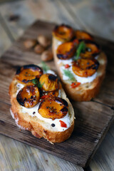 Delicious toast with cream cheese and grilled apricots. Healthy food. Apricot bruschetta.