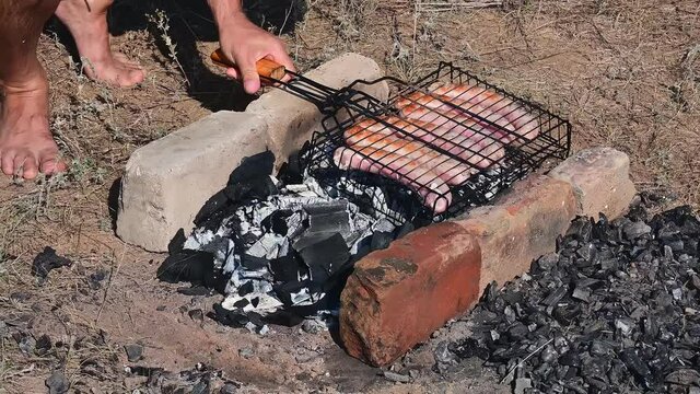  Man fries tradition kebabs shashlik on picnic.  