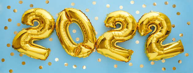 2022 year gold balloons with confetti on blue wall background. Happy New year 2022 eve celebration