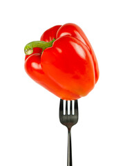 One red bell pepper on a fork isolated on a white background.