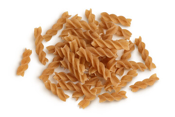 Wolegrain fusilli pasta from durum wheat isolated on white background with clipping path and full depth of field. Top view. Flat lay.