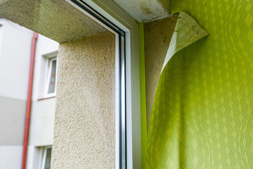 wallpaper peeled off due to moisture or poor quality gluing