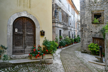 Fototapeta na wymiar A narrow street of Castro dei Volsci in medieval town of Lazio region, Italy.