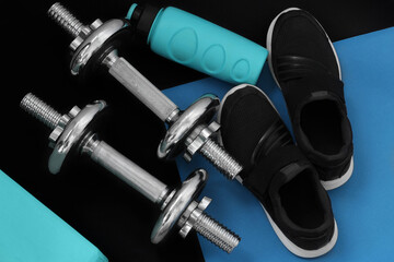 sports equipment on a black and blue background top view