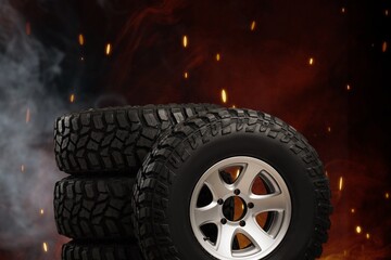 Naklejka premium Tyres are on fire. Burning old tyres on recycling landfill. Smoke from tires fire.