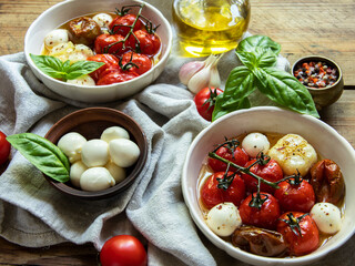 Salad. Baked tomato, basil, garlic with mozzarella cheese, ceramic dishes. cooking, cooked dish
