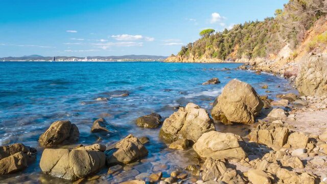 Time lapse: empty beach at Cala Violina, Tuscany, Italy. Rocky bay in natural park dramatic coast rocky headland and pine forest mediterranean sea turquoise transparent water