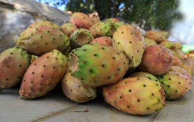 Whole Prickly prickly figs freshly ripe on the market stall.