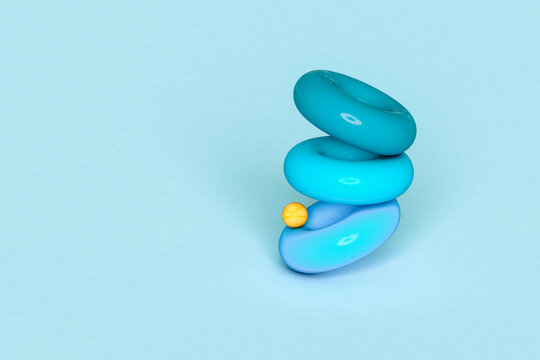 Blue torus and a yellow sphere on blue background - 3D 