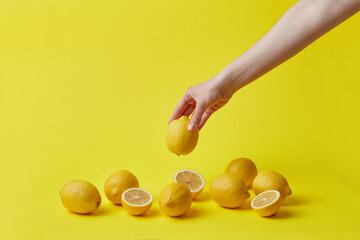 Woman taking fresh lemon