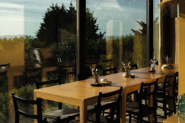 Long table set by the big window