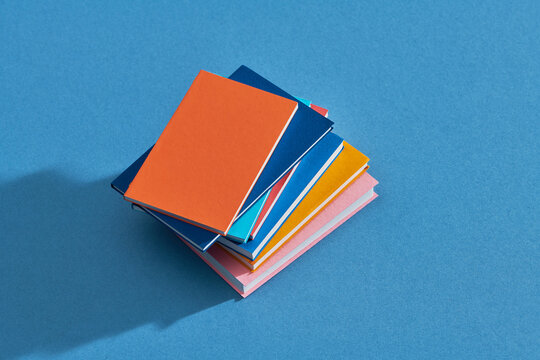 Book stack on a blue background