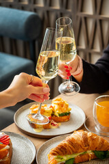 women drinking champagne in cafe