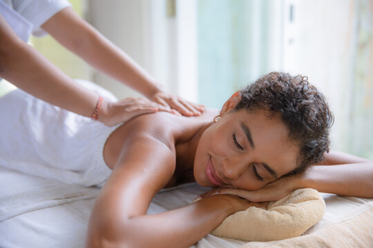 Smiling Woman Gets Relaxing Back Massage