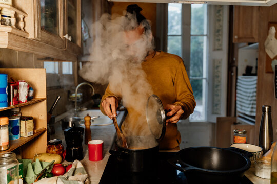 YOUNG Man cooking healthy food at home