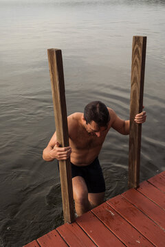 Man getting out of the lake 