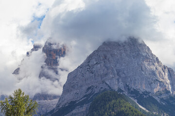 Fototapeta premium Cima Brenta, the highest mountain in Brenta Dolomites, from Rendena Valley on a cloudy day. Trentino Alto Adige, South Tyrol, Italy. Copy space.