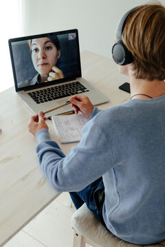 Teacher giving lesson for student in video chat
