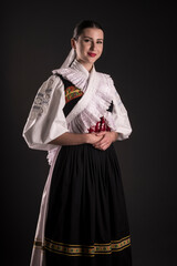 Young beautiful slovak woman in traditional dress. Slovak folklore