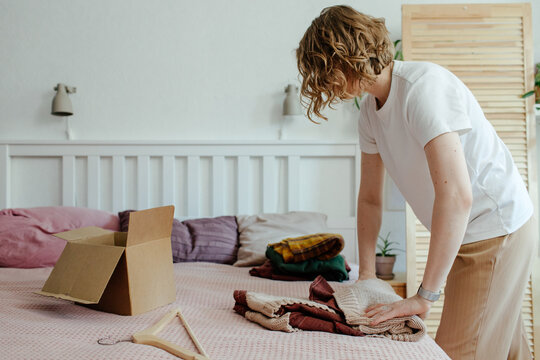 Woman packing wear for selling on internet