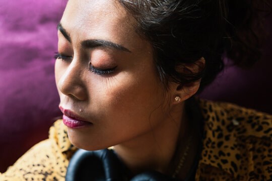 Exhausted woman resting her eyes