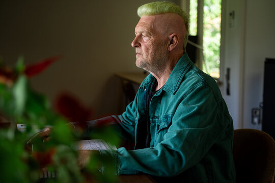 serious Senior man working at home office