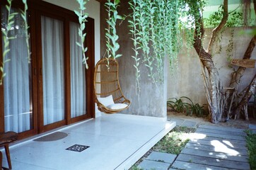 outdoor patio wicker swing chair with pillows