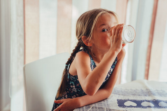The girl drinks water.