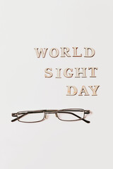 World Sight Day on 10th October. Copy Space. Glasses for improving vision. Flat lay. Top view.