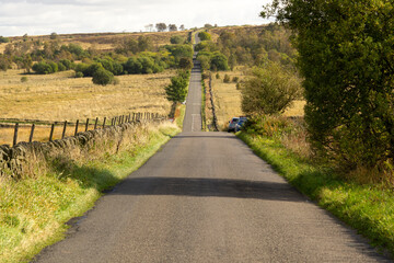 Fototapeta na wymiar Long straight Roman road in the Derbyshire Peak District