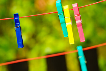 Clothes pegs on line outdoor. Housework