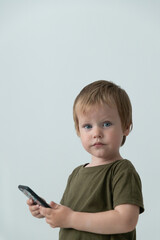 little boy with phone about gadgets
